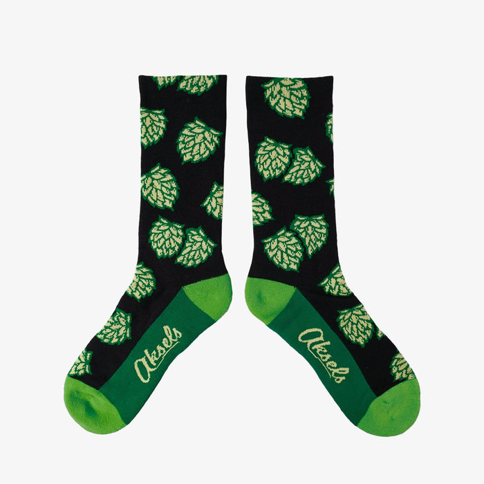Black socks with green hop pattern and green variation heel and toe.