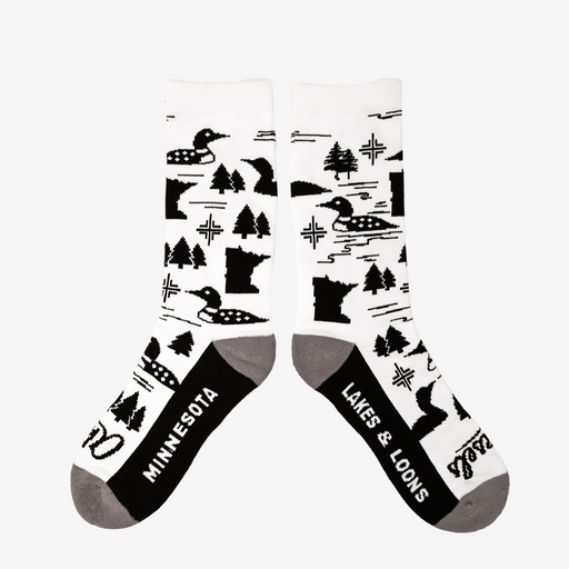White socks with black patterns of loons, trees, and the state of Minnesota on a white background.