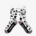 White socks with black patterns of loons, trees, and the state of Minnesota on a white background.